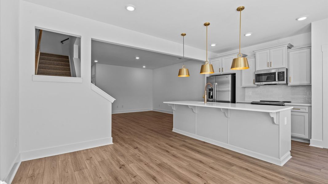 Notable 9-foot island provides generous prep and gathering space in this thoughtfully designed kitchen