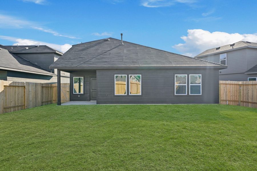 Exterior details and patio area of a home in Grand Pines, Magnolia (Image 4).