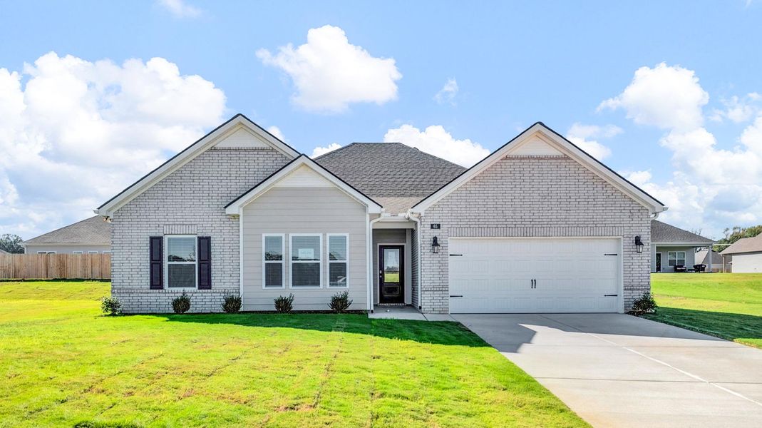 Front exterior of a new home in Riverwood Gardens, Oakland, TN, highlighting curb appeal (Image 1).