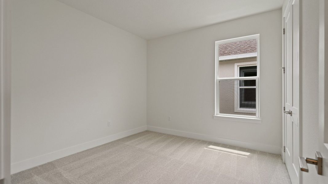 Second Bedroom of the Buttonwood by DRB Homes at Trailside in Mount Dora, FL.