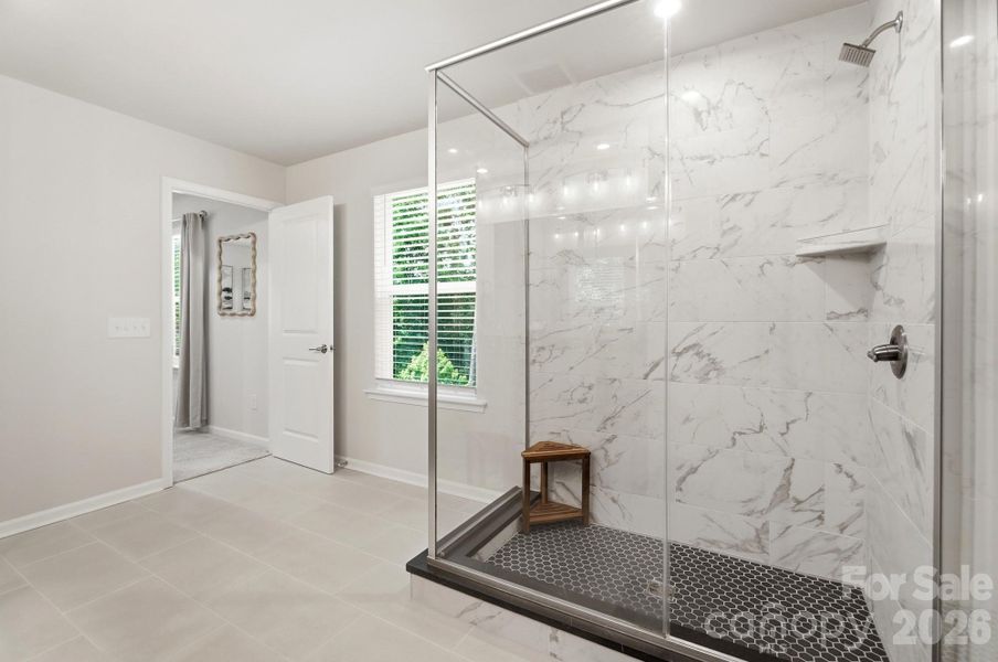 Another owner upgrade-tile walls and glass enclosure!