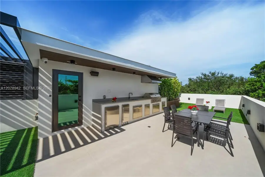 Exterior details and patio area of a home in , Miami (Image 25). Exterior details and patio area of a home in , Miami (Image 25).