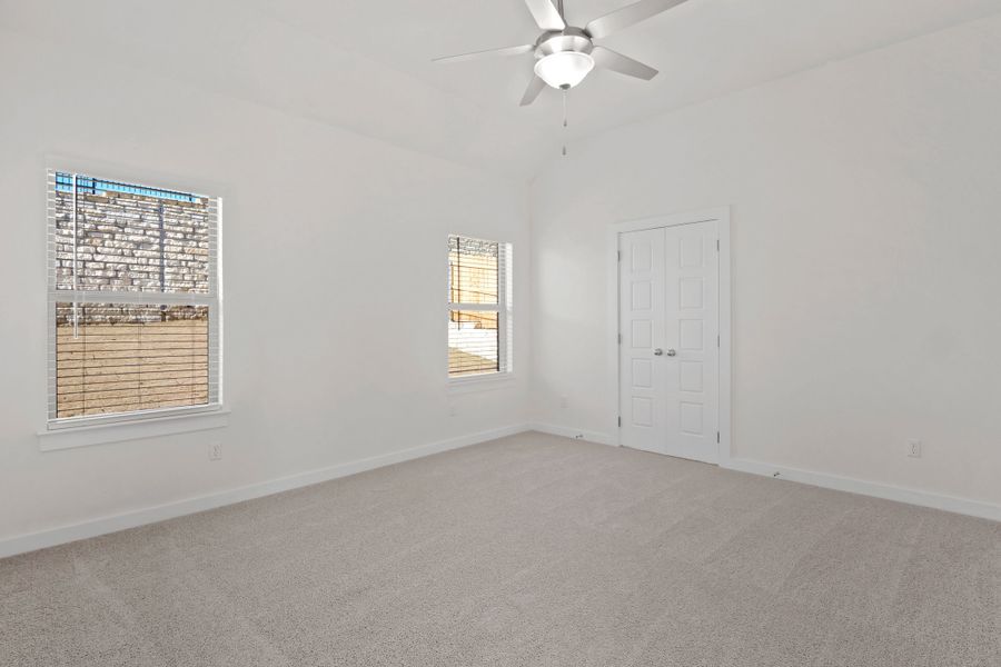 Primary Bedroom in the Pecan II home plan by Trophy Signature Homes – REPRESENTATIVE PHOTO