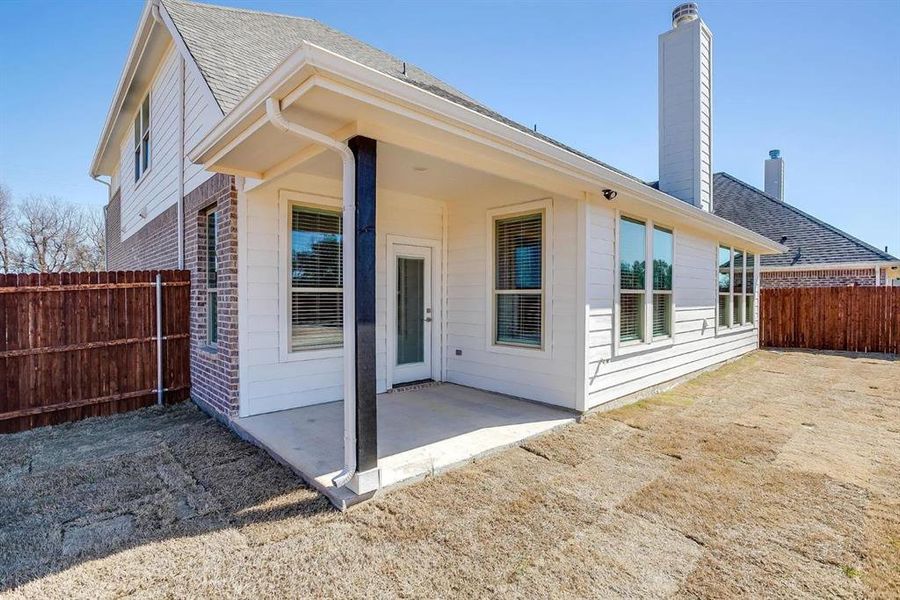 Rear view of house featuring a patio area