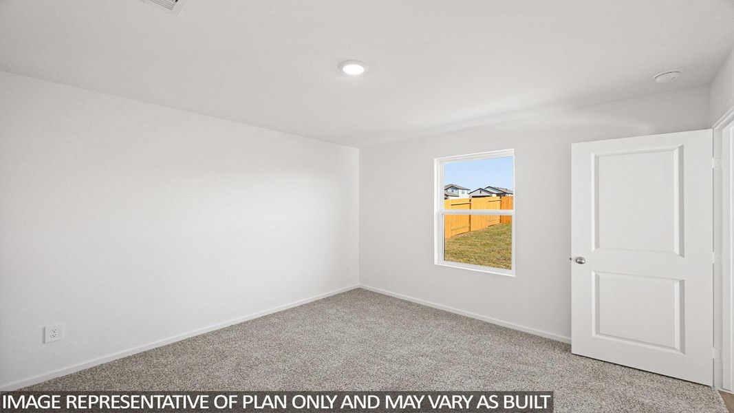 Spare room with light carpet and baseboards