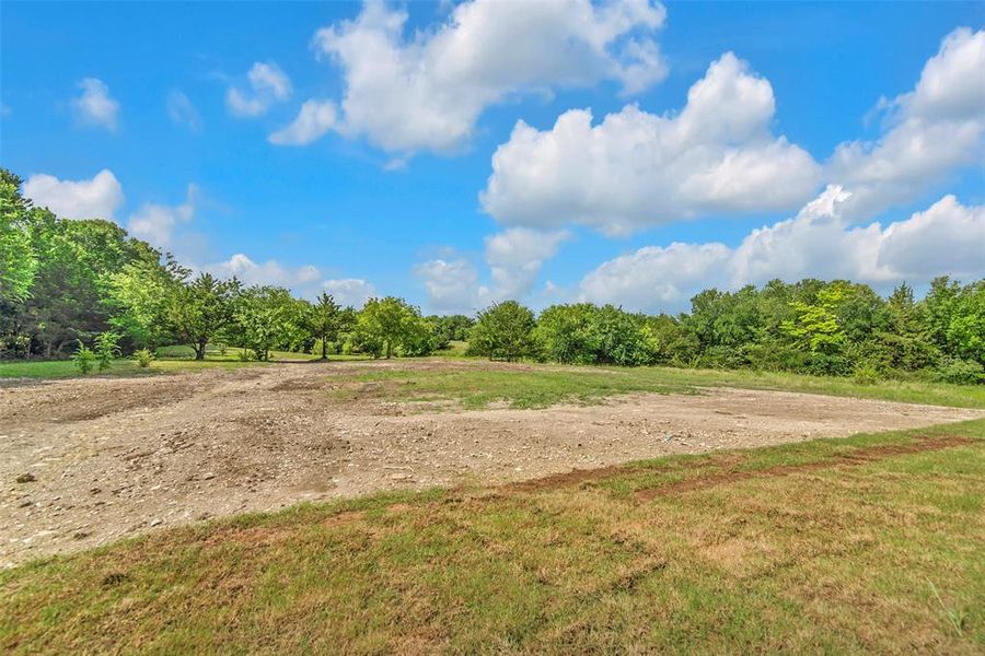 View of the over 1 acre lot backyard. View of the over 1 acre lot backyard.