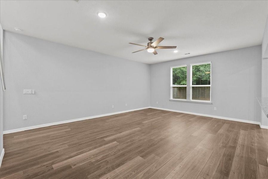 View of the living room towards the back of the home.