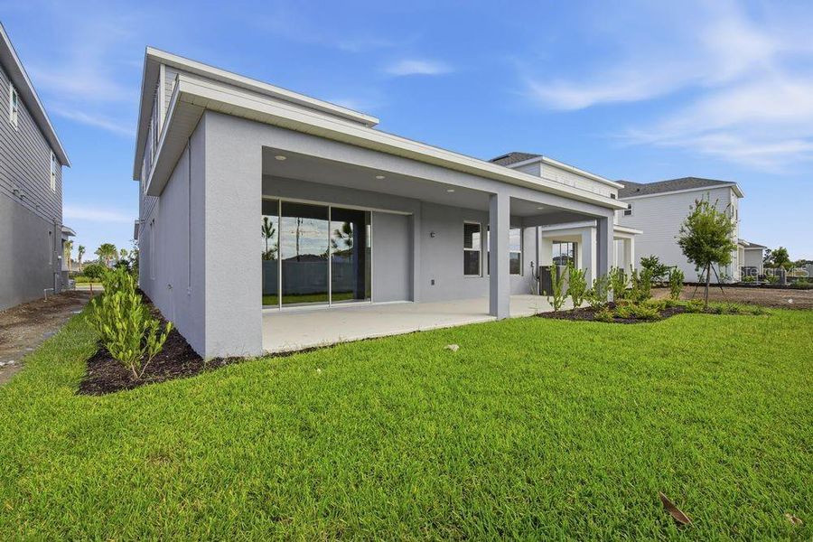 Exterior details and patio area of a home in Indigo Creek, Apollo Beach (Image 3).