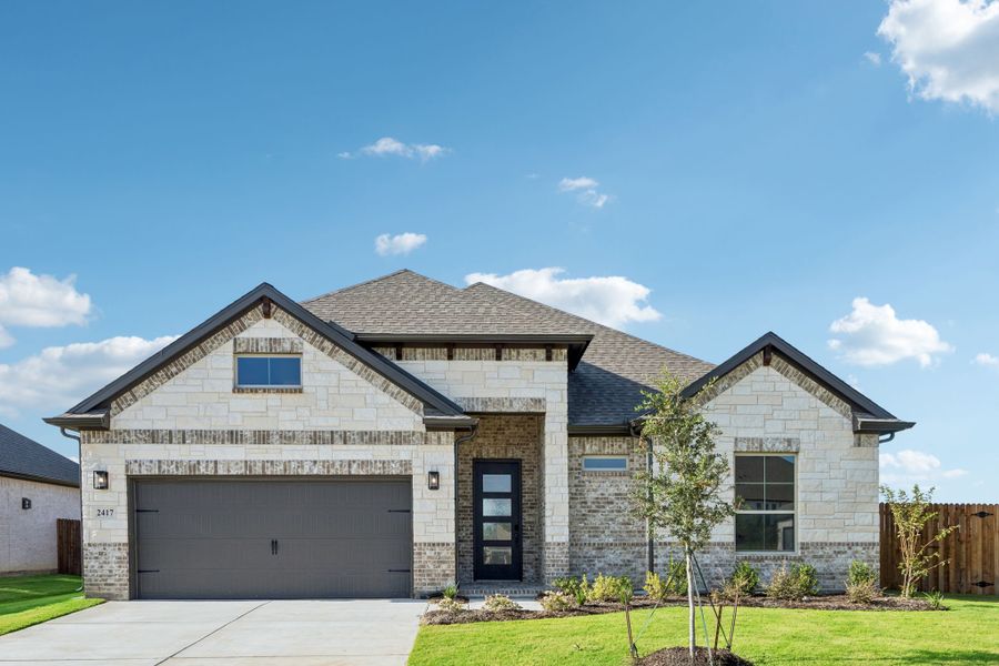 Front exterior of a new home in Sheppard's Place, Waxahachie, TX, highlighting curb appeal (Image 1). Front exterior of a new home in Sheppard's Place, Waxahachie, TX, highlighting curb appeal (Image 1).