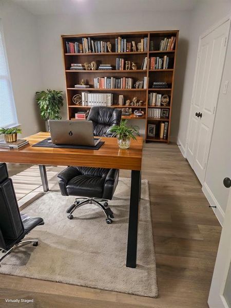 Office featuring hardwood / wood-style floors