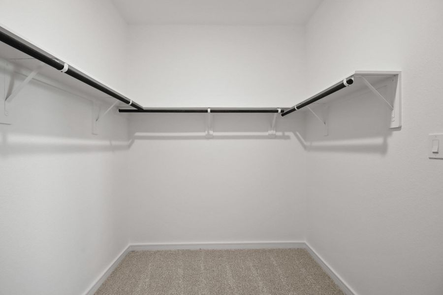 Walk-in closet in the primary suite (*Photo not of actual home and used for illustration purposes only.)