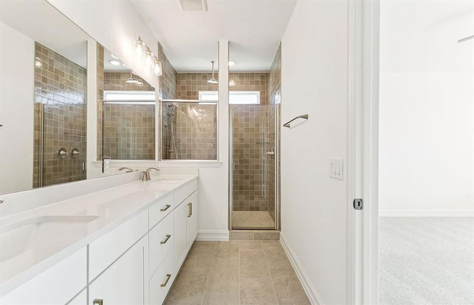 Owner's bath with large shower and double sinks Owner's bath with large shower and double sinks