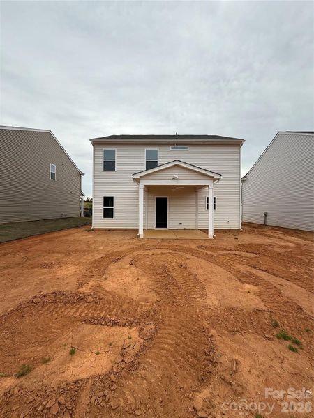 Covered Rear Patio with Fan and will be screened in