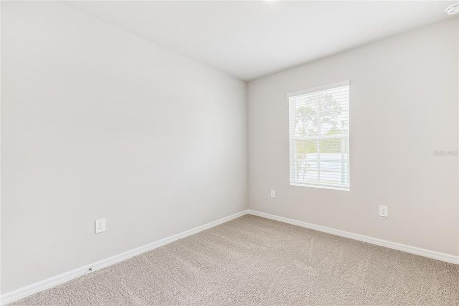 Spacious, unfurnished interior of a new home in Heritage Lake Park, Punta Gorda (Image 13).