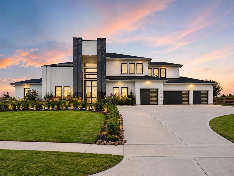Front exterior of a new home in Fulshear Run, Fulshear, TX, highlighting curb appeal (Image 2). Front exterior of a new home in Fulshear Run, Fulshear, TX, highlighting curb appeal (Image 2).