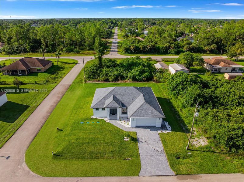 Front exterior of a new home in , Lehigh Acres, FL, highlighting curb appeal (Image 25).