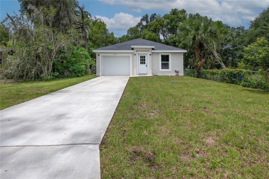 Front exterior of a new home in , Deland, FL, highlighting curb appeal (Image 21).
