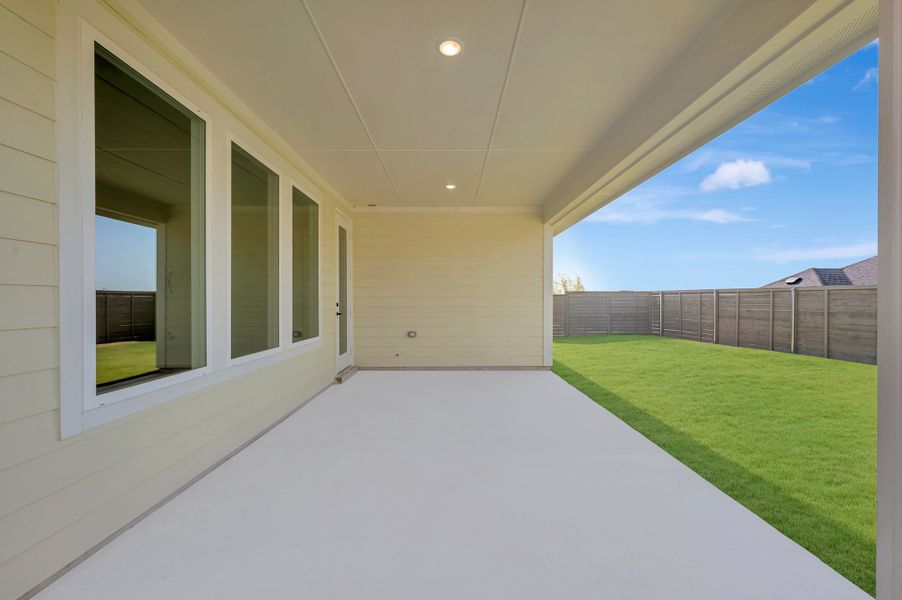 Exterior details and patio area of a home in Treeline, Justin (Image 3).