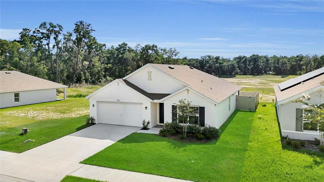 Front exterior of a new home in Autumn Glen, Belleview, FL, highlighting curb appeal (Image 22).
