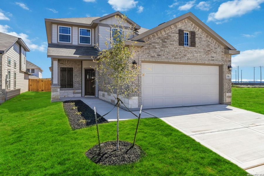 Front exterior of a new home in Katzer Ranch, Converse, TX, highlighting curb appeal (Image 1). Front exterior of a new home in Katzer Ranch, Converse, TX, highlighting curb appeal (Image 1).