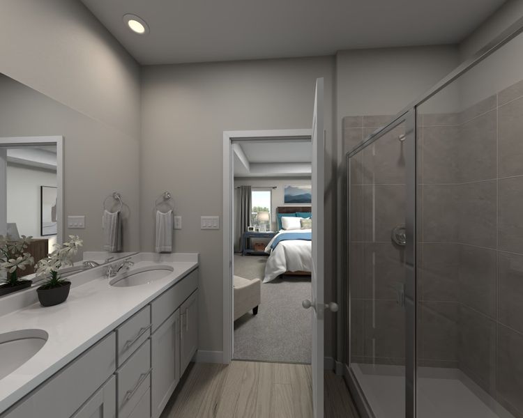 The ensuite bathroom features dual-vanity sinks and a walk-in closet.