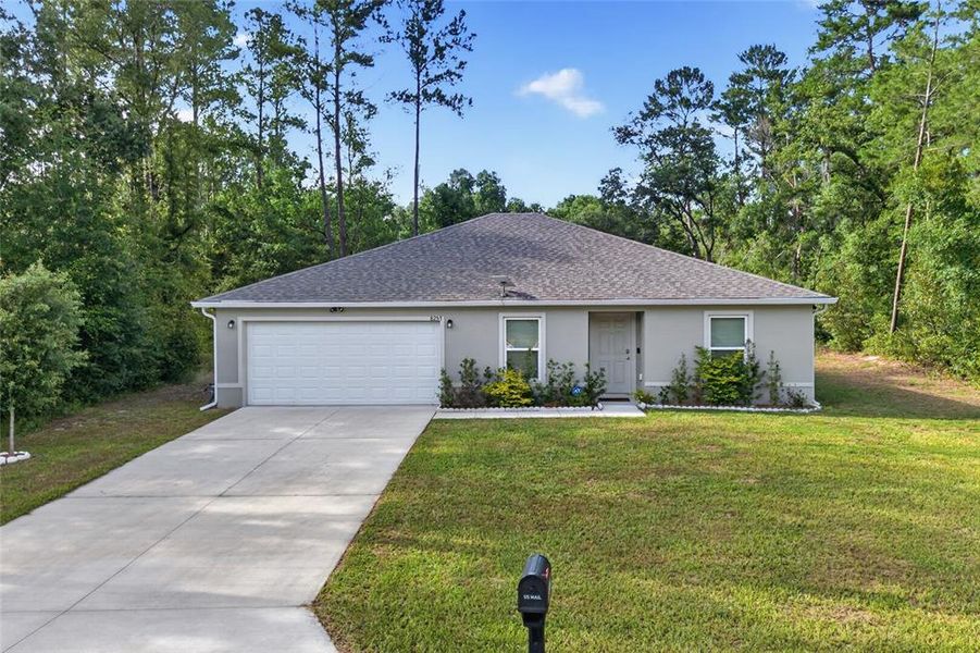 Front exterior of a new home in Ocala, Ocala, FL, highlighting curb appeal (Image 22). Front exterior of a new home in Ocala, Ocala, FL, highlighting curb appeal (Image 22).