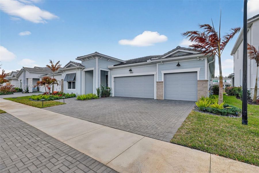 Front exterior of a new home in , Port St. Lucie, FL, highlighting curb appeal (Image 23).