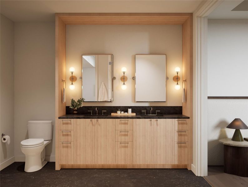 Primary bathroom featuring a dual-sink vanity with quartzite countertop, warm wall sconces, and framed mirrors. Coordinated with tiled walls, limestone flooring, and recessed lighting in the Twilight palette.