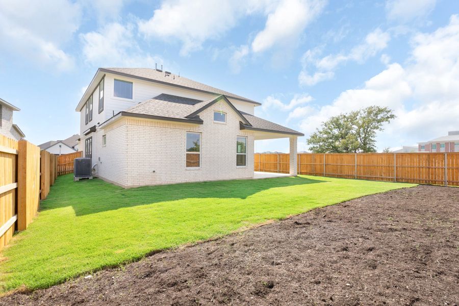 Exterior details and patio area of a home in Lariat, Liberty Hill (Image 23).