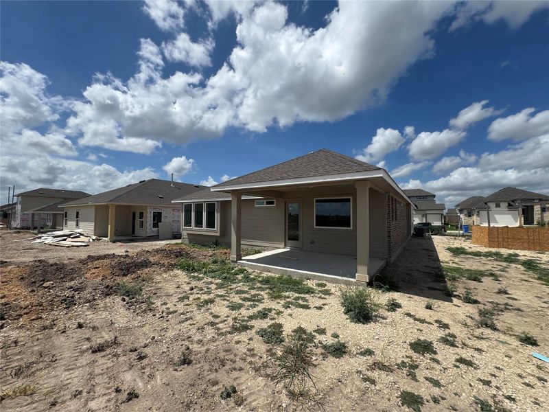 Front exterior of a new home in Village at Three Oaks, Seguin, TX, highlighting curb appeal (Image 2).