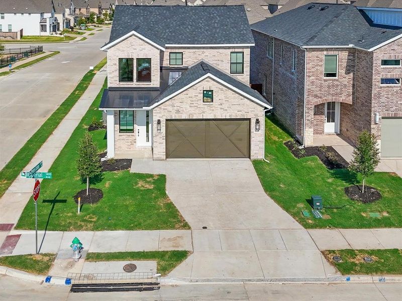 Front exterior of a new home in Royal Court, Little Elm, TX, highlighting curb appeal (Image 17). Front exterior of a new home in Royal Court, Little Elm, TX, highlighting curb appeal (Image 17).