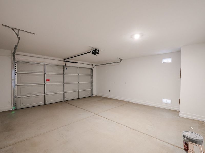 A room with a large metal cabinet and a fan.