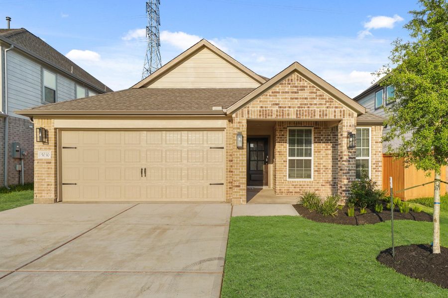 Front exterior of a new home in Sunterra North, Katy, TX, highlighting curb appeal (Image 9). Front exterior of a new home in Sunterra North, Katy, TX, highlighting curb appeal (Image 9).