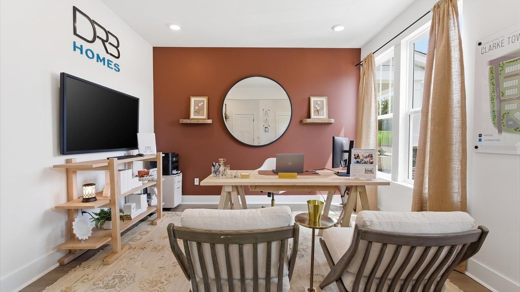 Exclusive front of the home flex room with refined millwork and a peaceful, private setting at Clarke Townes