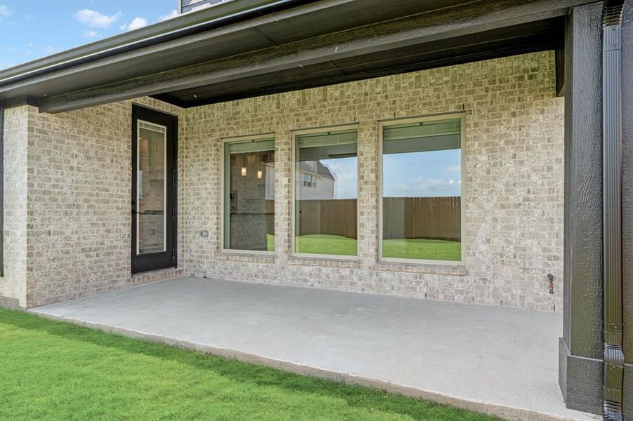 Exterior details and patio area of a home in Wildflower Ranch 60-65, Justin (Image 22). Exterior details and patio area of a home in Wildflower Ranch 60-65, Justin (Image 22).
