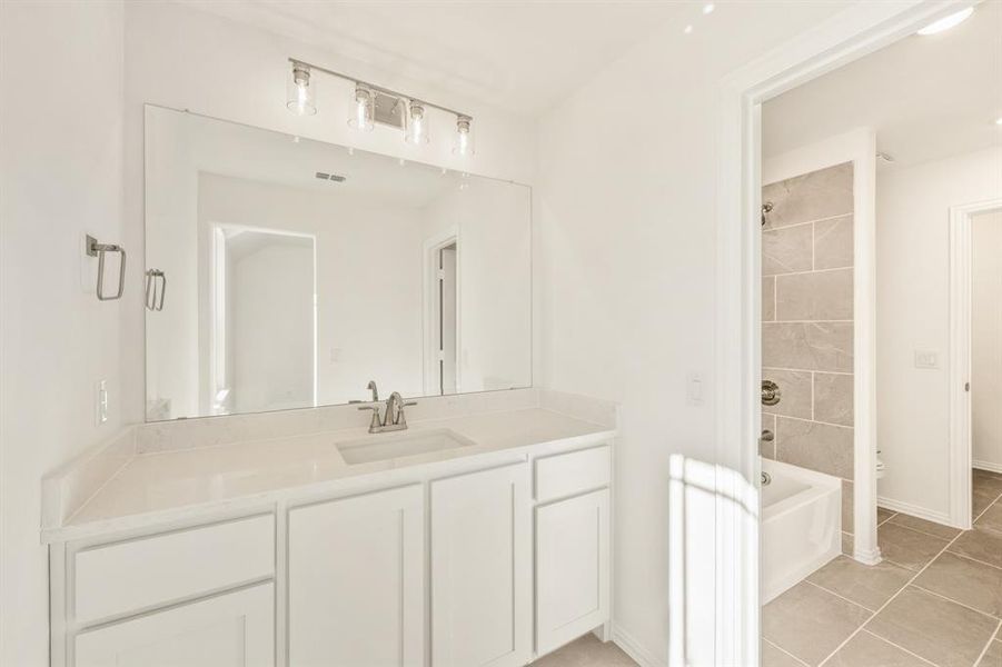 Furnished interior view inside a new home in Country Lakes, Denton (Image 14).