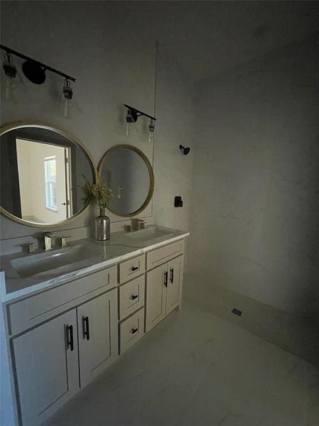 Primary bathroom featuring vanity and walk in shower