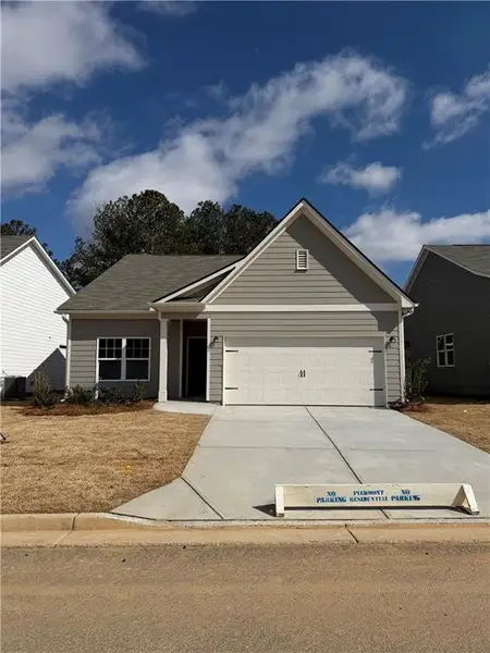 Front exterior of a new home in Villages at Cedar Hill, Dallas, GA, highlighting curb appeal (Image 1). Front exterior of a new home in Villages at Cedar Hill, Dallas, GA, highlighting curb appeal (Image 1).