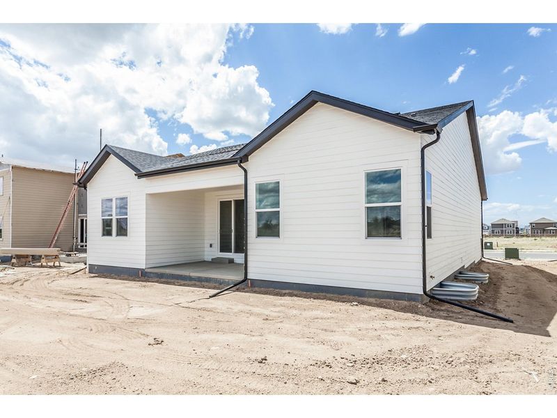 Exterior details and patio area of a home in Prairie Song Story Collection - Single Family Homes, Windsor (Image 3).