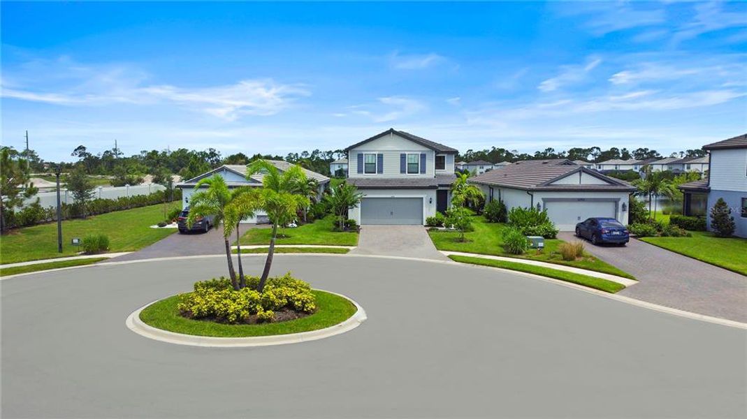 Front exterior of a new home in , Lakewood Ranch, FL, highlighting curb appeal (Image 1).