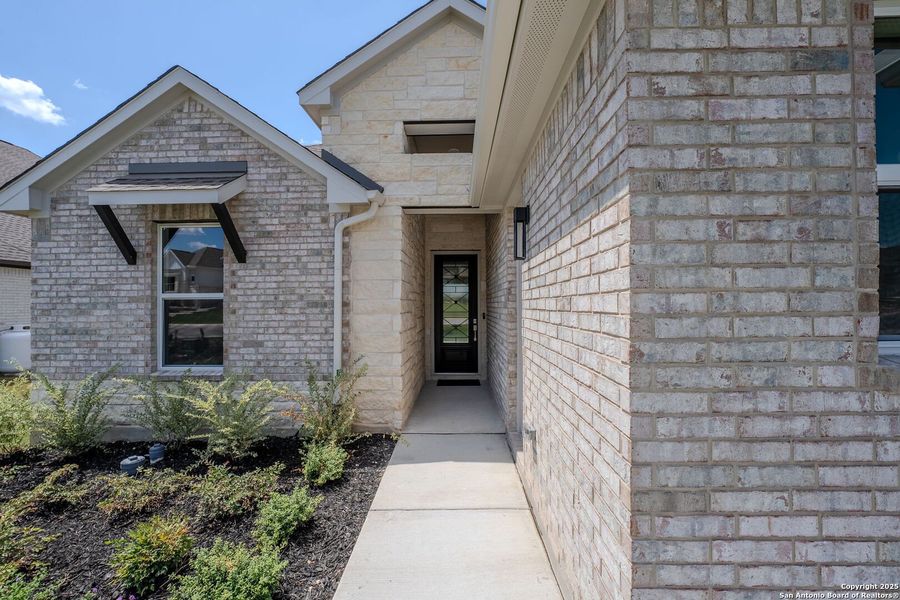 Front exterior of a new home in Arbors at Fair Oaks, Fair Oaks Ranch, TX, highlighting curb appeal (Image 2).