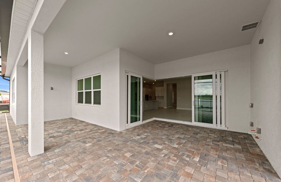 Exterior details and patio area of a home in Del Webb Oak Creek, North Fort Myers (Image 25).