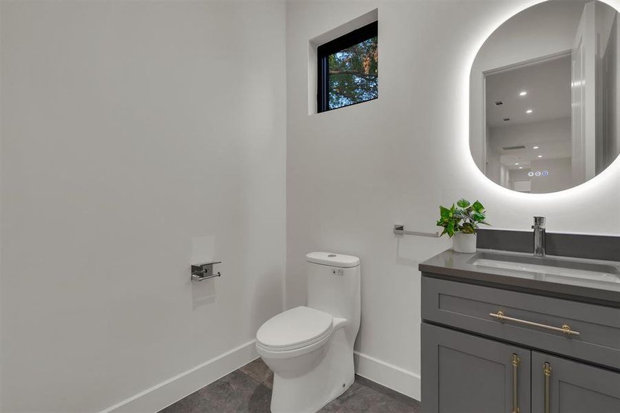 Bathroom with vanity and toilet