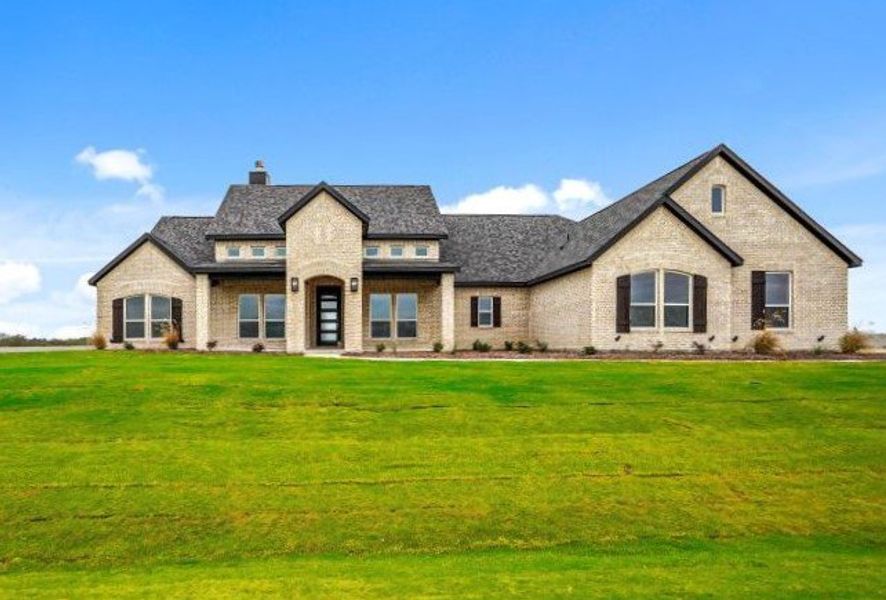 Front exterior of a new home in Rocky Top Ranch, Reno, TX, highlighting curb appeal (Image 24). Front exterior of a new home in Rocky Top Ranch, Reno, TX, highlighting curb appeal (Image 24).