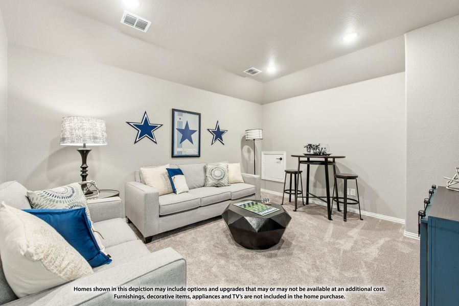 Bonus room with gray sofas, carpet flooring, and a small bar-height table in the corner