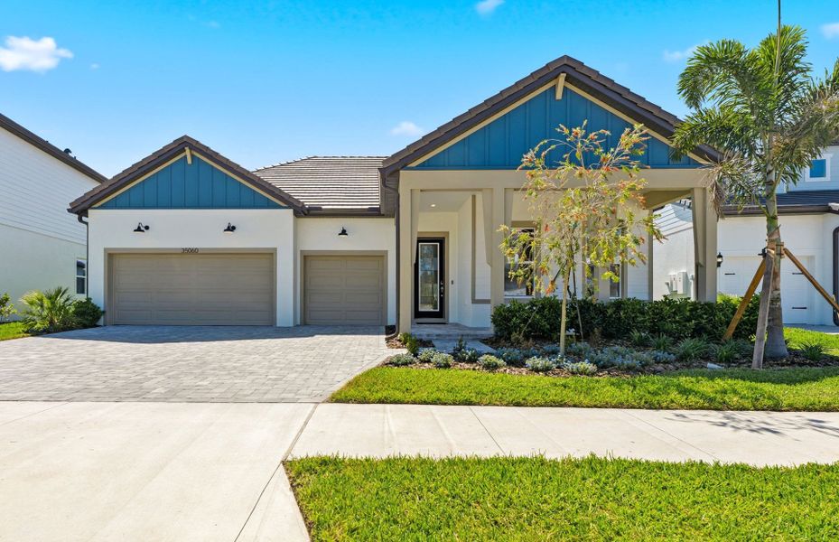 Representative exterior photo of a completed home built from the Mahogany by Pulte Homes in Two Rivers, Zephyrhills, FL (Image 1). Representative exterior photo of a completed home built from the Mahogany by Pulte Homes in Two Rivers, Zephyrhills, FL (Image 1).