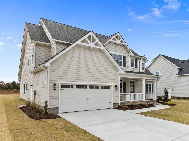 Front exterior of a new home in Eli's Ridge, Winterville, NC, highlighting curb appeal (Image 25).