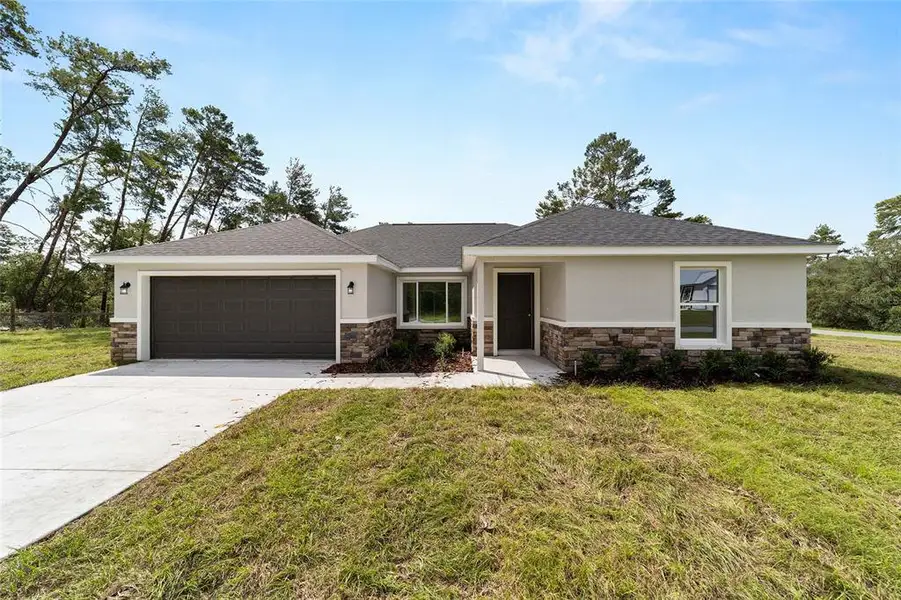 Front exterior of a new home in , Dunnellon, FL, highlighting curb appeal (Image 1). Front exterior of a new home in , Dunnellon, FL, highlighting curb appeal (Image 1).