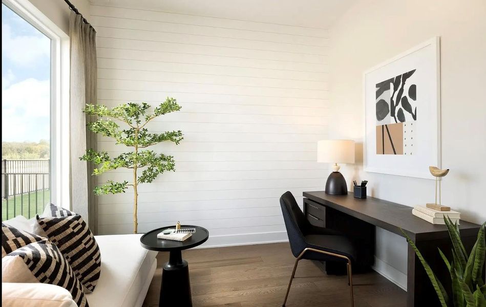 Office space featuring dark wood finished floors and healthy amount of natural light