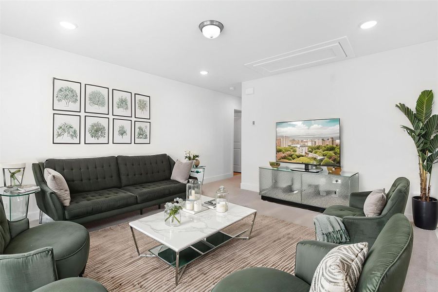 Spacious upstairs game room with soft carpet flooring—perfect for movie nights, playtime, or entertaining guests. *Virtually Staged*